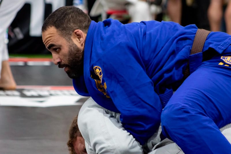 A competitor applying top pressure in a match